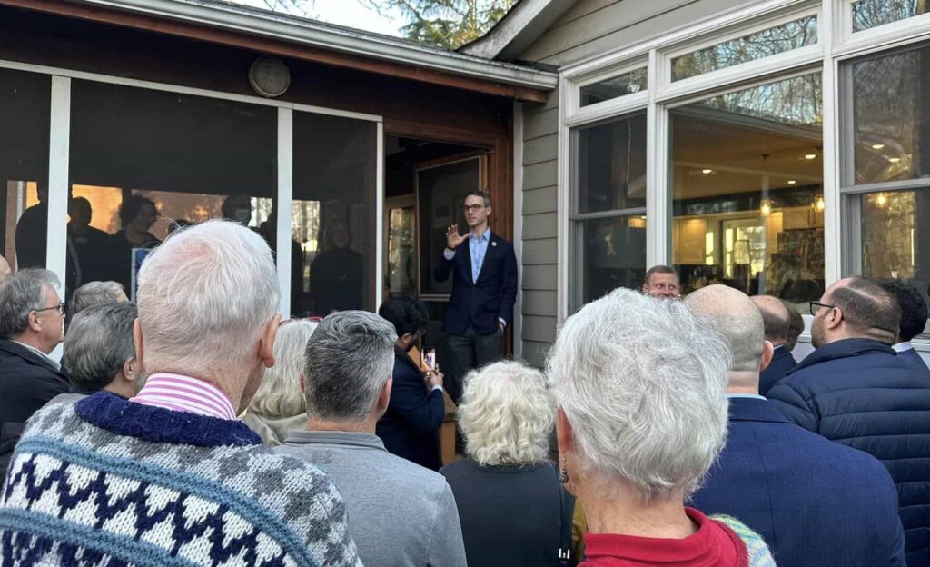 Photo of Supervisor James Walkinshaw addressing a crowd outside a local home. Supervisor Walkinshaw's campaign kickoff in February, 2023.